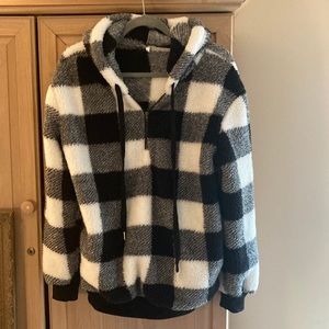 Oversized fuzzy hooded pullover.